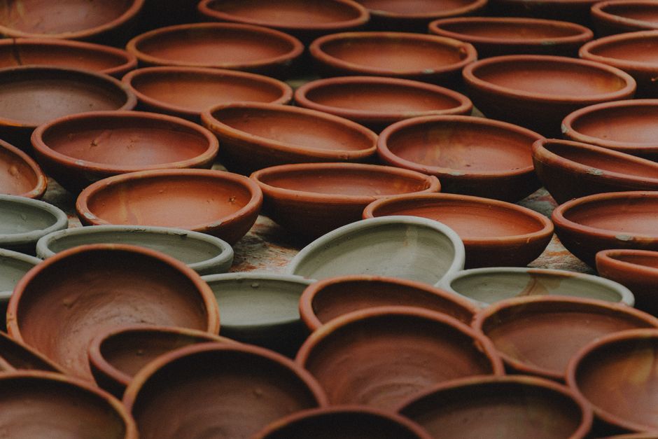 A traditional ceramic Boston baked bean pot filled with slow-cooked navy beans