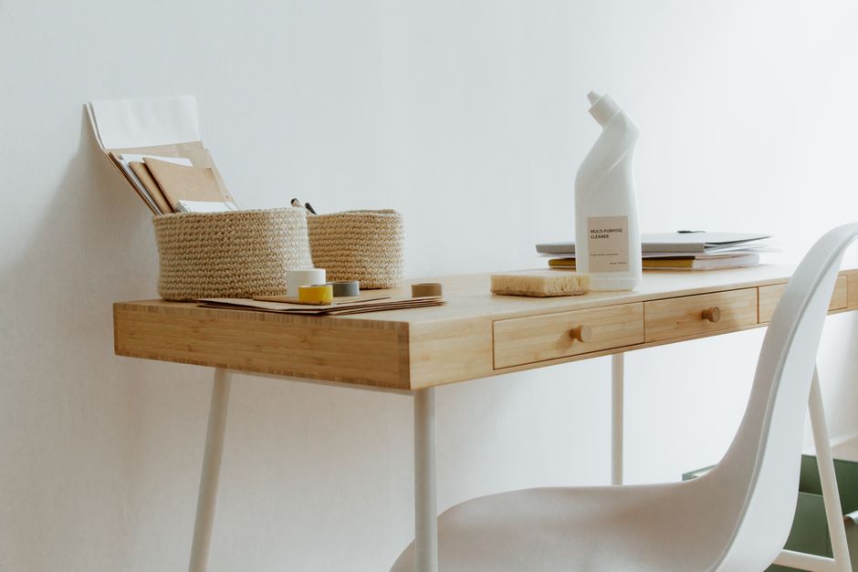 A clean, minimalist video editor workspace with dual monitors displaying editing software