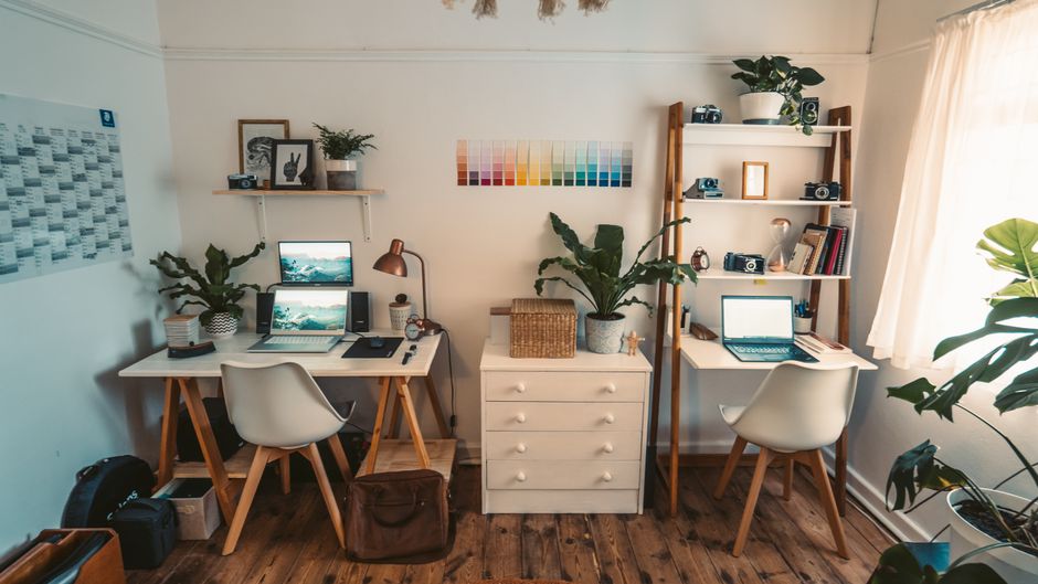 A cozy desk aesthetic with a cup of matcha latte, pastel stationery, and plush accessories