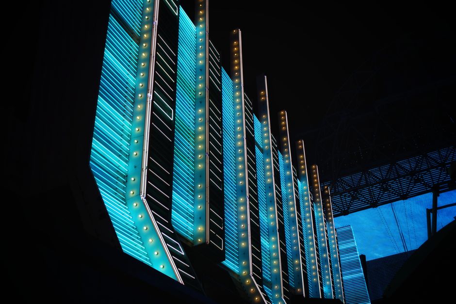 A glowing neon gaming setup with a smartphone displaying a viral TikTok gameplay clip