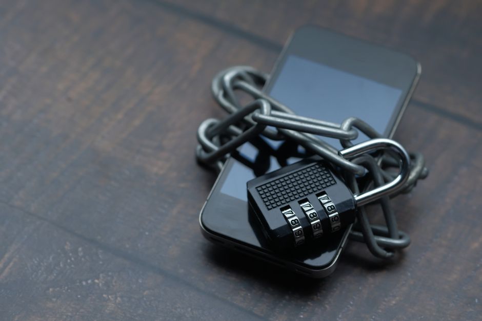 A secure smartphone display highlighting social media privacy controls and shield icons