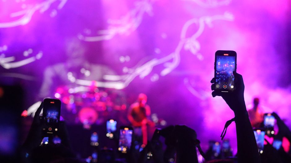 A vibrant smartphone display showing humorous social media user profiles and viral meme aesthetics