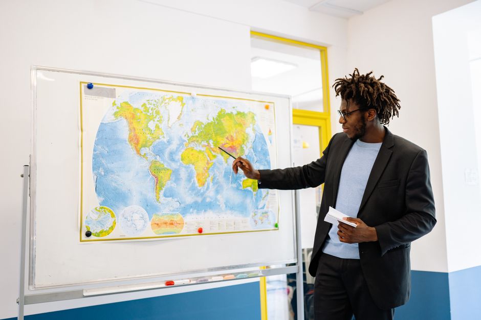 A whiteboard mapping out creative username word-pairing formulas with colorful dry-erase markers showing verbs, moods, and color concepts