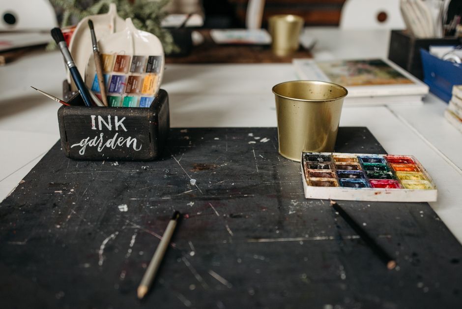 Creative workspace setup with notebook brainstorming viral TikTok username combinations