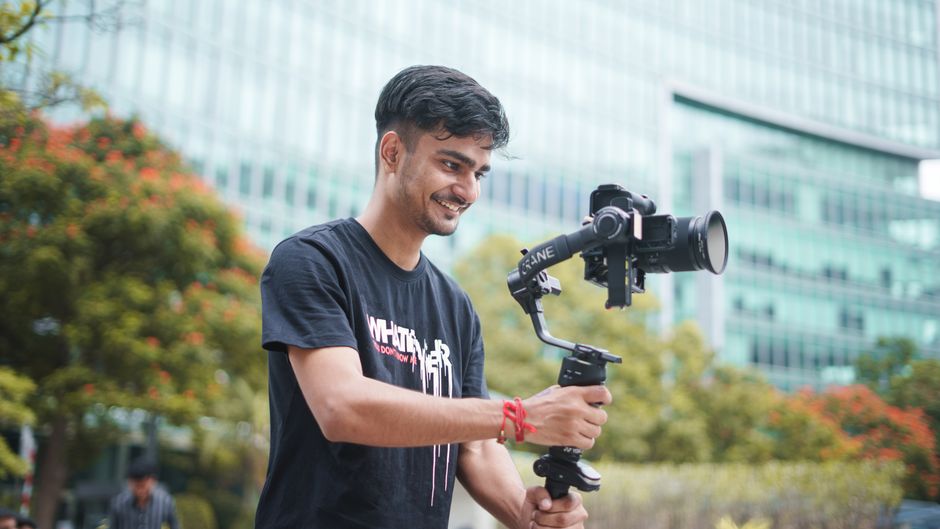 Creator filming an announcement video explaining their new account username to followers
