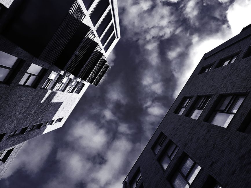 Dramatic high-contrast silhouette against a dark celestial night sky and glowing eclipse