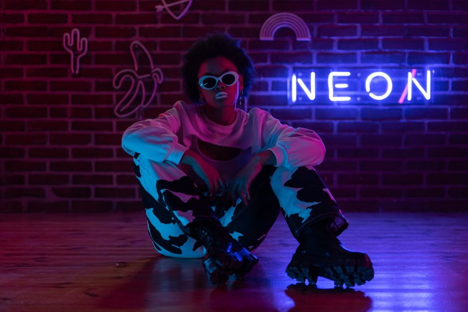 Edgy neon-lit street aesthetic featuring bold fashion and urban creator setups