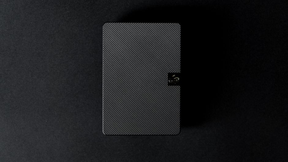 External solid-state drive connected to a laptop alongside cloud backup transfer icons
