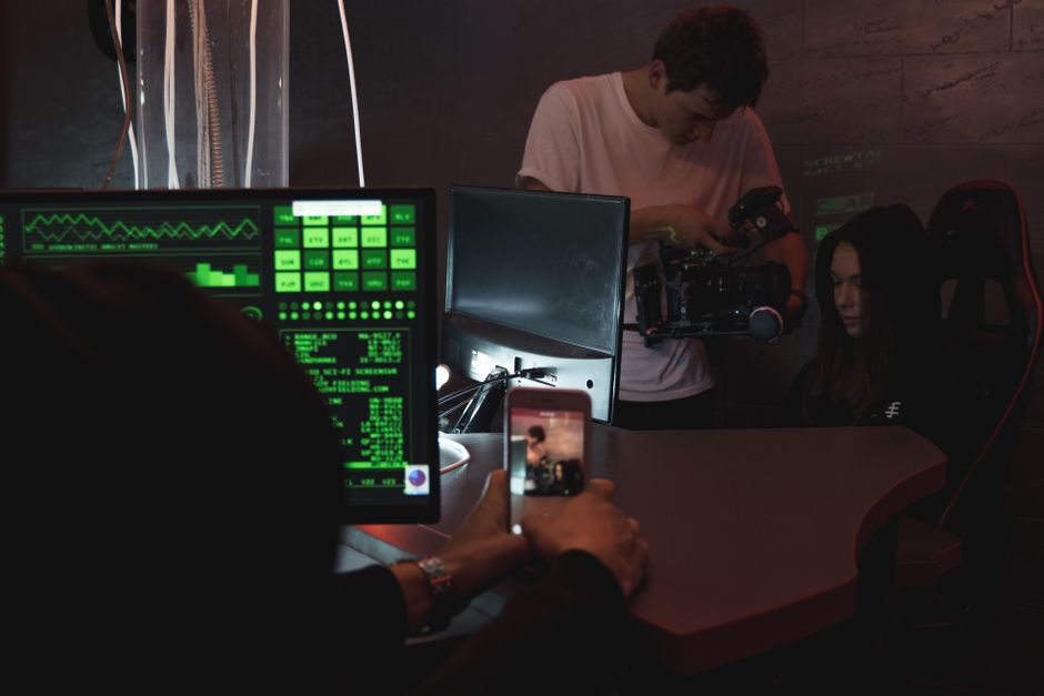 Gamer recording gameplay highlights for TikTok with dynamic RGB lighting