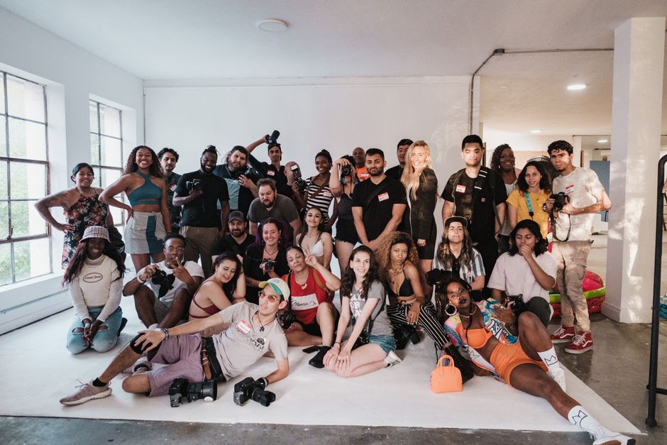 Group of creative content creators collaborating with smartphones in a modern studio setup