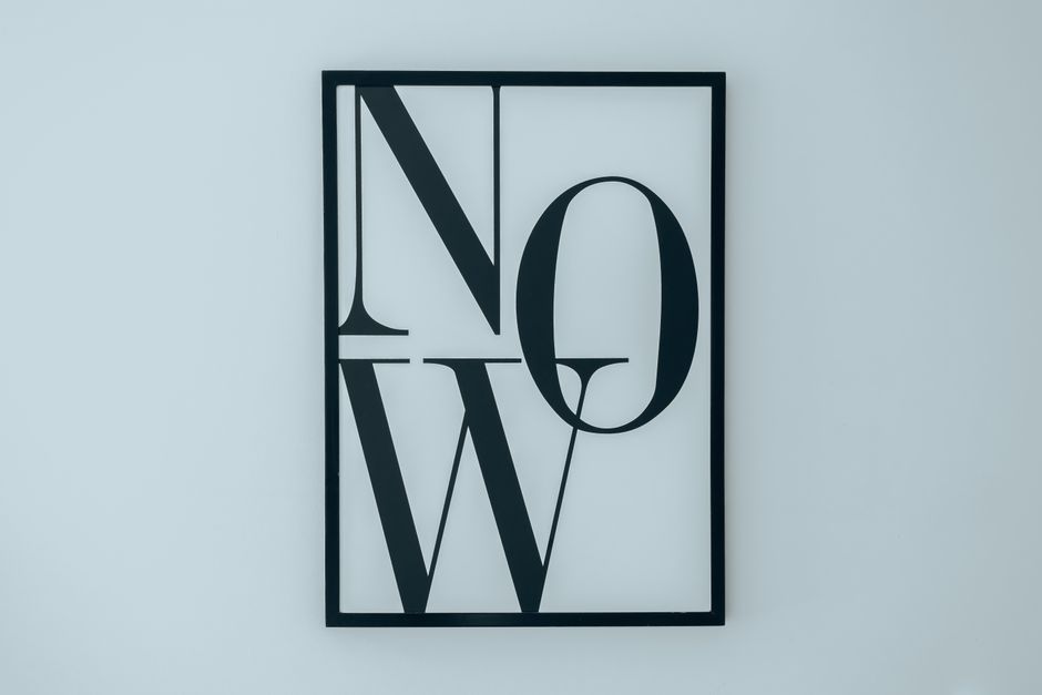 Minimalist monochrome smartphone typography showcasing clean graphic letters