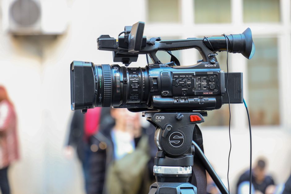 Professional video editing timeline showing color grading curves, 4K resolution tags, and cinema aspect ratio previews
