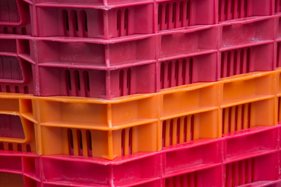 Stack of colorful Y2K mini CDs and transparent plastic tech accessories
